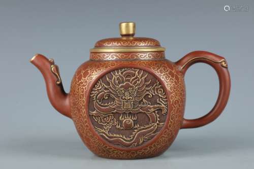 A Zisha Teapot With Dragon Pattern