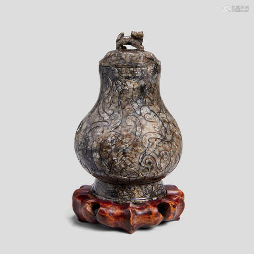 A jade vase and cover