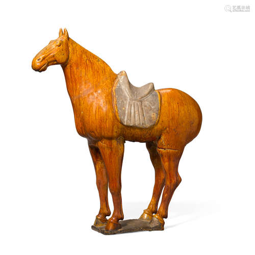 A chestnut glazed pottery model of a saddled horse Tang dynasty