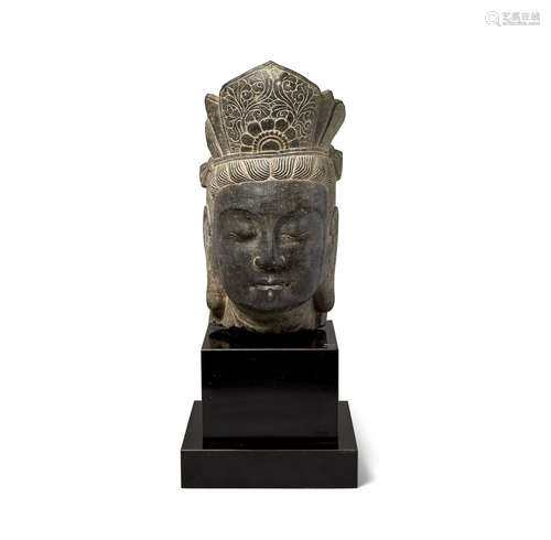 A carved stone head of a bodhisattva 20th century