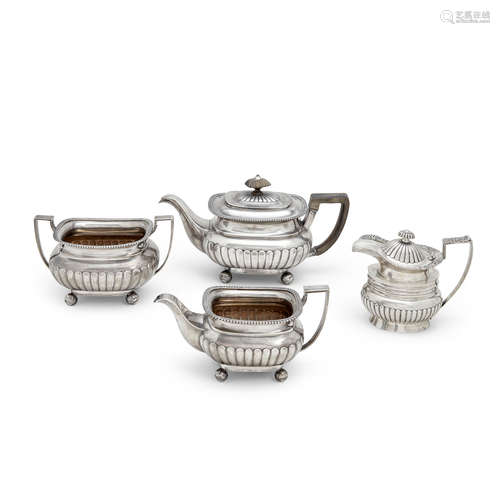 A three piece chinese export regency style silver tea service and an associated pitcher 19th century