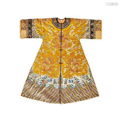 An embroidered yellow ground women's outer dragon robe Late 19th century