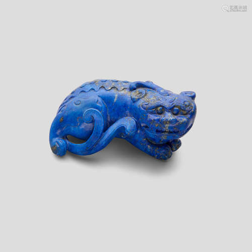 A carved Ming-style lapiz lazuli recumbent beast