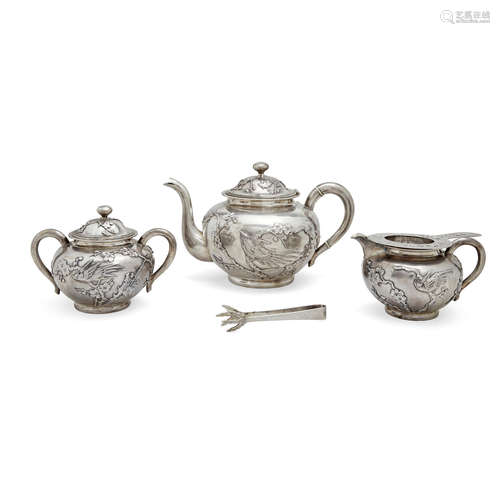 An assembled five piece Chinese export silver tea service with prunus design late 19th/early 20th century