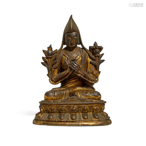 A gilt copper alloy figure of a lama 18th/19th century