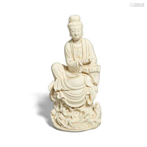 A Dehua blanc-de-chine figure of Guanyin He Chaozong mark