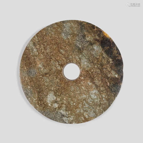 NEOLITHIC-STYLE GREEN AND RUSSET JADE BI DISC