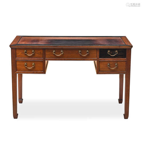 A hardwood five drawer desk 20th century