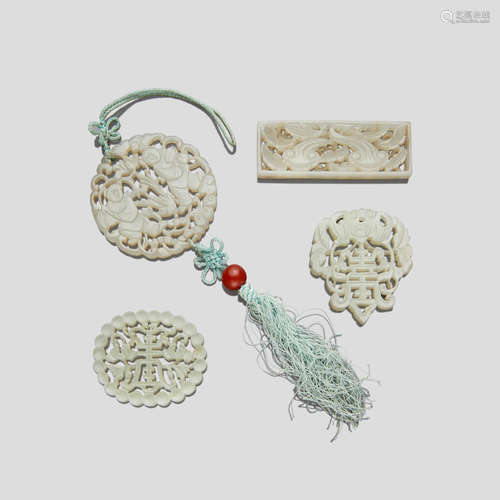 FOUR RETICULATED WHITE JADE PLAQUES Qing dynasty