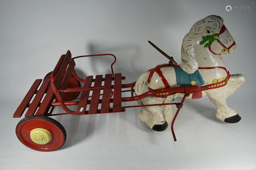 A child's pedal-car in the form of a horse and cart