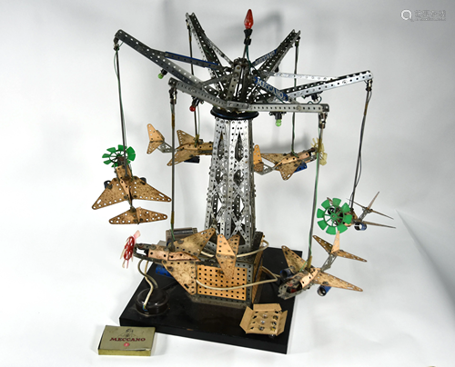 A Meccano carousel hung with six aircraft