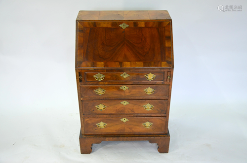 An 18th century diminutive feather banded walnut bureau