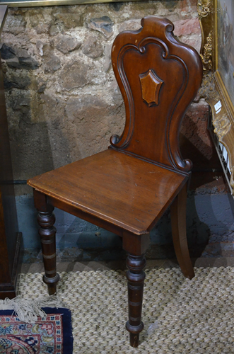 A Victorian mahogany moulded shield back hall chair