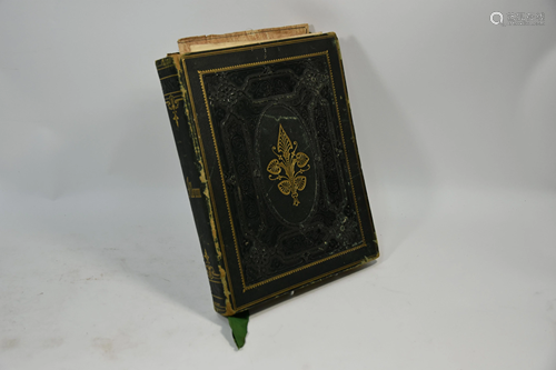 A Victorian embossed leather album containing a