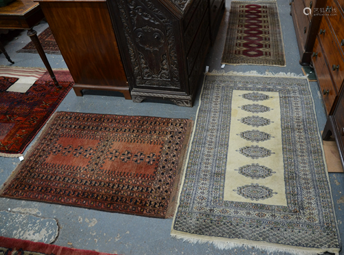 Two small red ground rugs