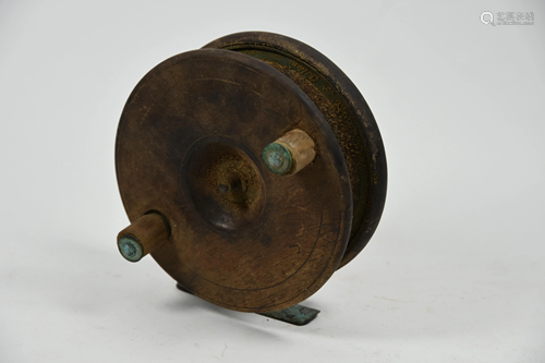 An antique mahogany and brass 5in salmon reel with