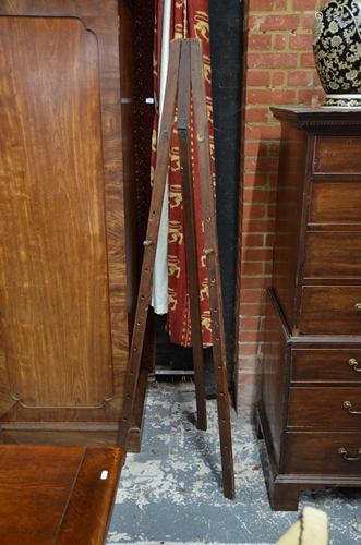 An antique stained pine folding easel,