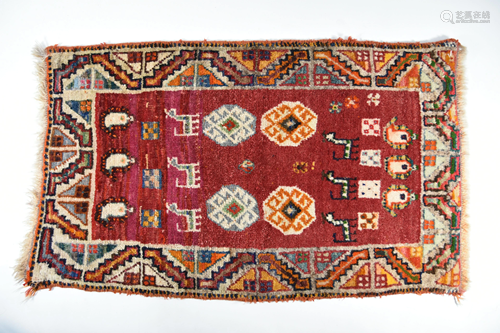 A Persian Gabbeh small red ground rug