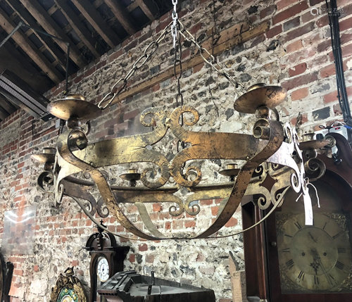 A large circular gilt metal six sconce hanging