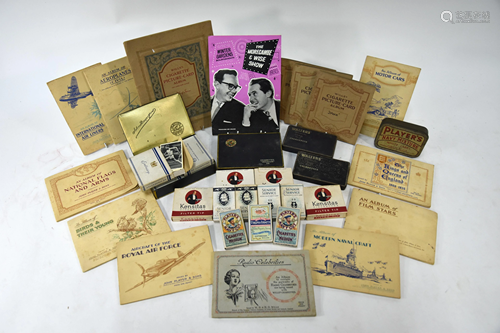 A quantity of cigarette cards in packets, tins and