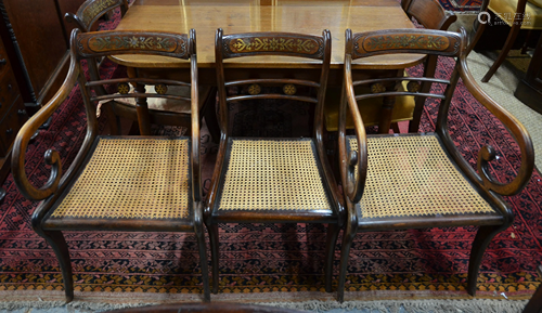 A set of eight Regency brass inlaid dining chairs