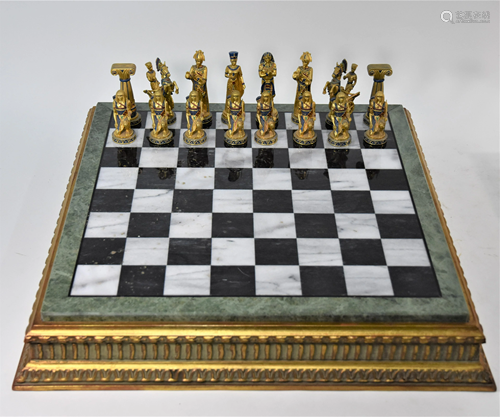 A modern inlaid marble and giltwood chess board