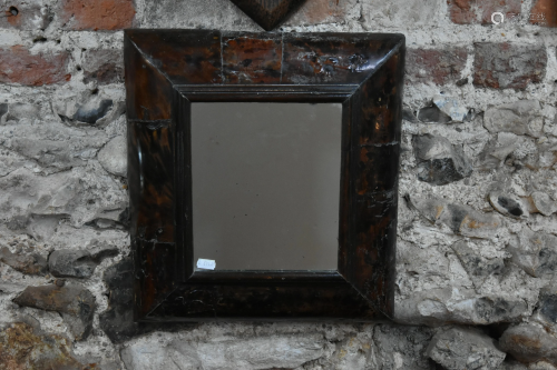 An antique oyster veneered walnut framed wall mirror