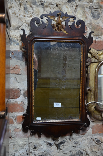 A 19th century mahogany fret mirror, the crest centred