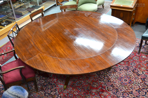 A 'Jupe' style extending mahogany dining table