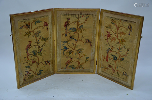 An antique giltwood framed triptych silk embroidered