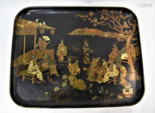 A late 19th century papier mache tray decorated in the