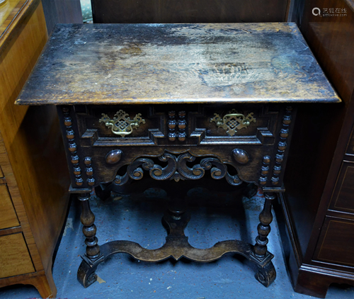 An antique oak side table in the William & Mary style