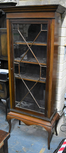 A mahogany astragal glazed cabinet on stand