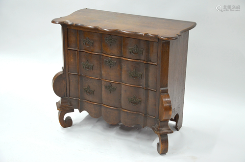 An antique continental oak three drawer commode chest