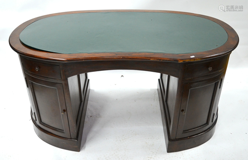 A mahogany kidney shaped kneehole desk