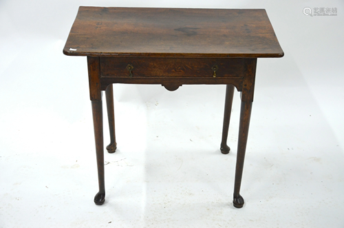 An early 18th century oak single drawer side table