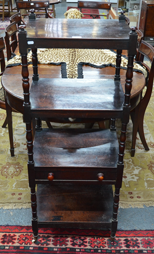 A Victorian mahogany four tier what-not with mid-height