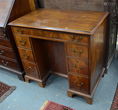 A George III mahogany kneehole desk