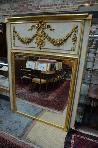 A large French parcel gilt and white distress paint