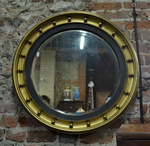 A 19th century giltwood framed circular bevel edged