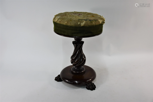 A Victorian mahogany piano stool