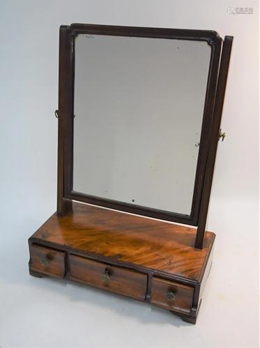 A 19th century mahogany toilet mirror on three drawer