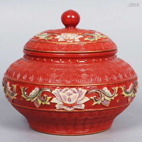 A Red Ground Carved Interlocking Flower Porcelain Jar and Cover