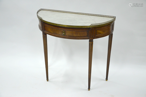 An antique veined walnut side table, with brass