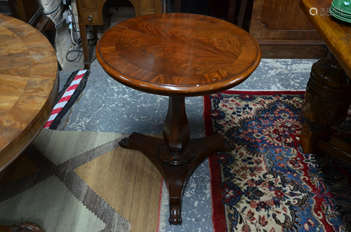 A Victorian cross banded flame mahogany tilt top