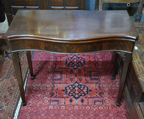 A Victorian mahogany serpentine form card table