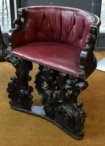 An antique carved oak demi-lune hall chair