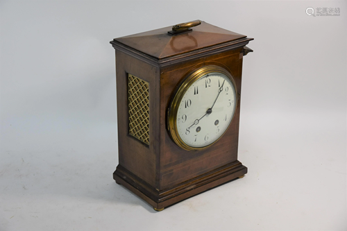 An antique walnut cased table clock