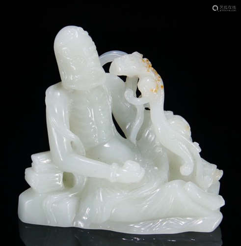 A HETIAN JADE CARVED BODHIDHARMA STATUE