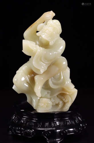 A HETIAN JADE CARVED ARHAT SHAPED STATUE